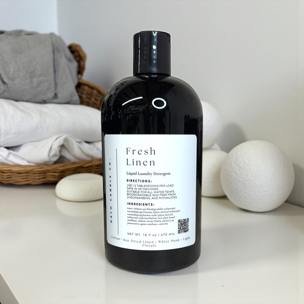 Fresh Linen liquid laundry detergent bottle with wool dryer balls